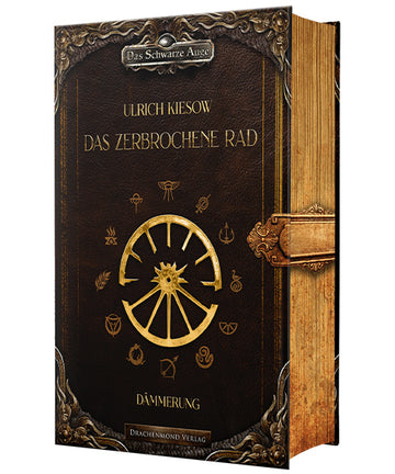 Das Cover zeigt mittig ein goldenes zerbrochenes Rad mit zwölf Speichen. Umrandet ist das Rad mit den Symbolen der zwölf Götter aus den Büchern. Im oberen und unteren Bereich befindet sich je eine Zierleiste, in der oberen ist der Reihentitel eingearbeitet. Autor und Titel stehen darunter, der Untertitel ist unter dem Rad. Rechts ist mittig ein Verschluss aufgemalt, der über den Buchschnitt verläuft, so dass es wirkt, als wäre das Buch verschlossen. Das Cover ist dunkel-, der Buchschnitt hellbraun.